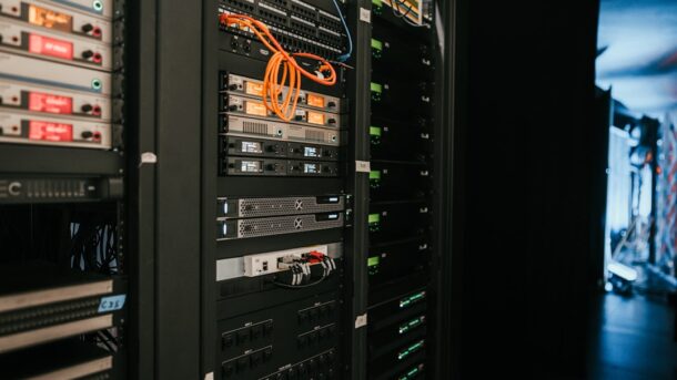 A rack of networking servers, evoking the early network hardware of the ARPANET era