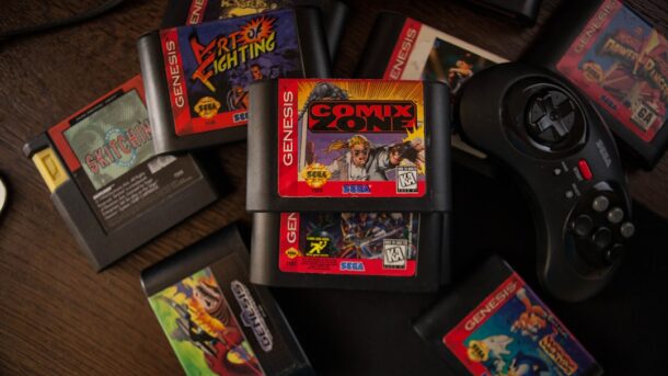 Stack of retro NES-era video game cartridges, evoking the gold Legend of Zelda cartridge released in 1987