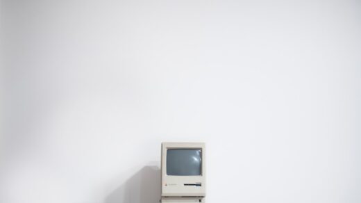 A vintage CRT computer monitor, evoking the mid-1990s era when eBay launched as AuctionWeb