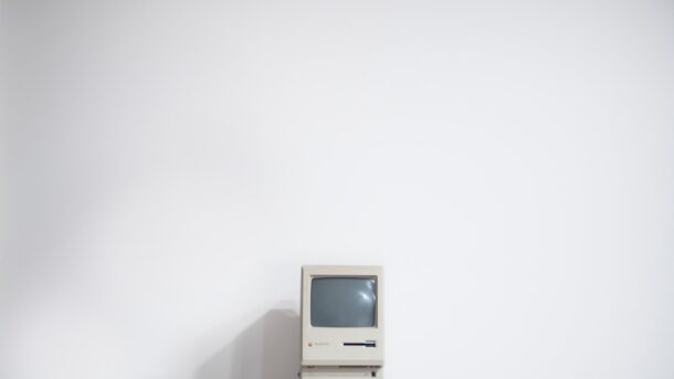 A vintage CRT computer monitor, evoking the mid-1990s era when eBay launched as AuctionWeb